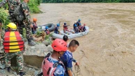 Rescuers in Nepal search for 2 buses with more than 50 people on board that was swept into a river