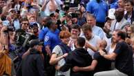 Jannik Sinner gets a hug from his friend Seal after winning the US Open title