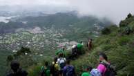 At one of Rio de Janeiro's hardest trails, a paraplegic athlete climbed into clouds