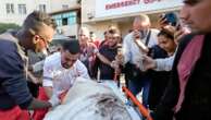 A Gaza medic realizes he's carrying his own mother's body, killed by an Israeli airstrike