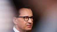 A day of 2 prime ministers in Poland begins the delayed transition to a centrist, pro-EU government