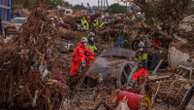 Heavy rains in Barcelona disrupt rail service as troops search for more flood victims in Valencia