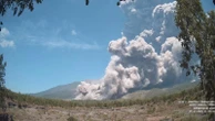 Residents wear masks as volcanic ash blankets villages near erupting volcano