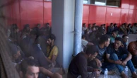Photos show migrants intercepted near Crete arrive at Greek port of Lavrio from Libya