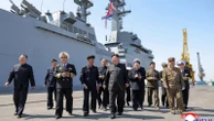 North Korean leader supervises missile tests from his naval destroyer