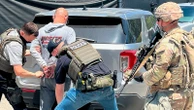 Photos show National Guard with rifles on ICE enforcement missions