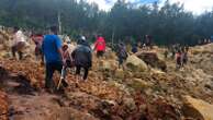 Emergency crews in Papua New Guinea move survivors of massive landslide to safer ground