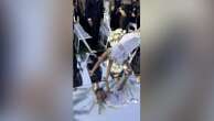 Raina Elegado via Storyful9-year-old flower girl wows with series of flips down wedding aisle