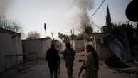 Syrian rebel force deploys to a village near Damascus to stop looters