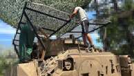 Ukrainian soldiers add metal netting to US tanks to protect against Russian drones