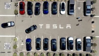 Parents of woman killed in Tesla crash allege design flaw trapped her in burning car