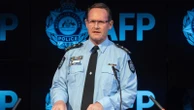 Woman becomes third person charged under Australia's foreign interference laws