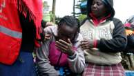 Kenyan officials remove bodies as they try to confirm the death toll from a school dormitory fire