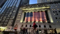 Asian benchmarks are mixed after Wall Street edges down from record highs
