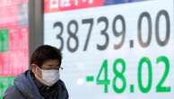 Asian shares trade mixed after Wall Street slumps