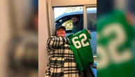 Jason Kelce signs jersey for McDonald's worker