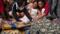Rio favelas left reeling after lethal gang raid as families bury the dead