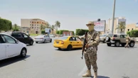 A warlord and 6 other people killed as militia infighting rocks Libya's capital, officials say