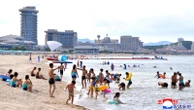 North Koreans swim and play at a beach resort touted as a boost for tourism