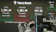 Asian shares track Wall Street's rally after Powell hints at rate cuts