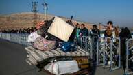 Hundreds of Syrians line up at Turkish border crossing, awaiting return home