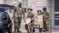 Guard members waiting for orders as they begin to gather in DC