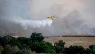 An uncontrolled wildfire sends a cloud of smoke over Spain's capital