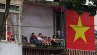 Photos show city balconies united under red flags for Vietnam's National Day