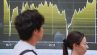 Asian shares trade mostly higher after stocks on Wall Street extend losses
