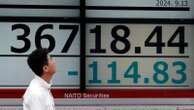 Asian markets trade mixed after Wall Street climbs closer to its record high