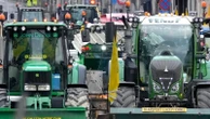 With blaring horns rumbling engines, farmers in tractors block Brussels to protest EU policies