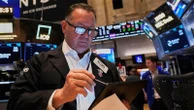 Asian shares trade higher after Wall Street climbs moderately as Fed holds rates steady