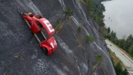 Car shell suspended on rock face above British Columbia highway in apparent prank