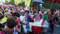 Street vendors dispense the party fuel for Rio’s Carnival, but face pushback as their numbers grow