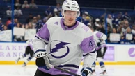 Lightning left wing Cole Koepke wearing neck guard following the death of Adam Johnson
