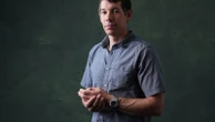 Alex Honnold is climbing Taipei 101 with no ropes, live on TV. It's drawing excitement — and concern