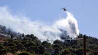 Two wildfires are burning near Greece's capital, fueled by strong winds