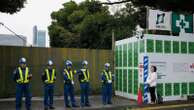 Developers begin cutting trees in a Tokyo park that environmentalists want to protect