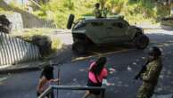 Thousands of soldiers fence off a Salvadoran neighborhood in pursuit of gang remnants