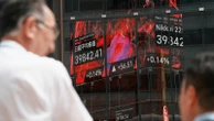 Asian shares are mixed as Trump’s tariff deadline looms, while US stocks set records