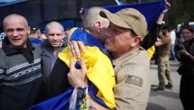 Kyiv hit by Russian strikes as largest prisoner swap of war begins
