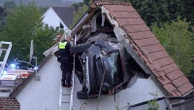 Car crashes into a barn's roof in Germany, seriously injuring 2