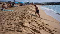 As Spaniards summer at Barcelona's beaches, some worry about the erosion of coastline
