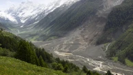 A river dammed by a huge Swiss landslide is flowing again. That's a relief to authorities
