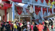 Earthquake off Indonesia topples buildings, kills 1 person and sets off small tsunami