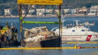 Superyacht pulled from seabed 10 months after sinking off Sicily