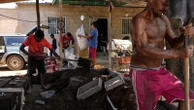 Migrants returning to Venezuela face debt and harsh living conditions