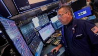 Asian shares mostly rise after Wall Street sets new records