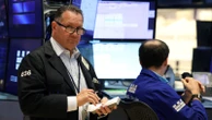 Dow closes up 840 points after Fed chair signals possible interest rate cut