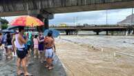 Monsoon rains worsened by offshore typhoon leave 8 dead and displace 600,000 in Philippines